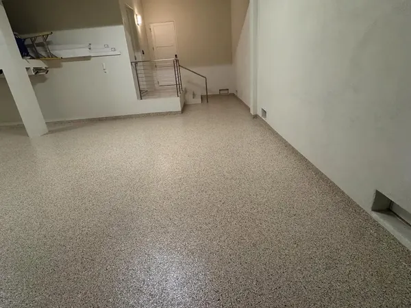 Lower-level garage tan flake epoxy floor Broward County